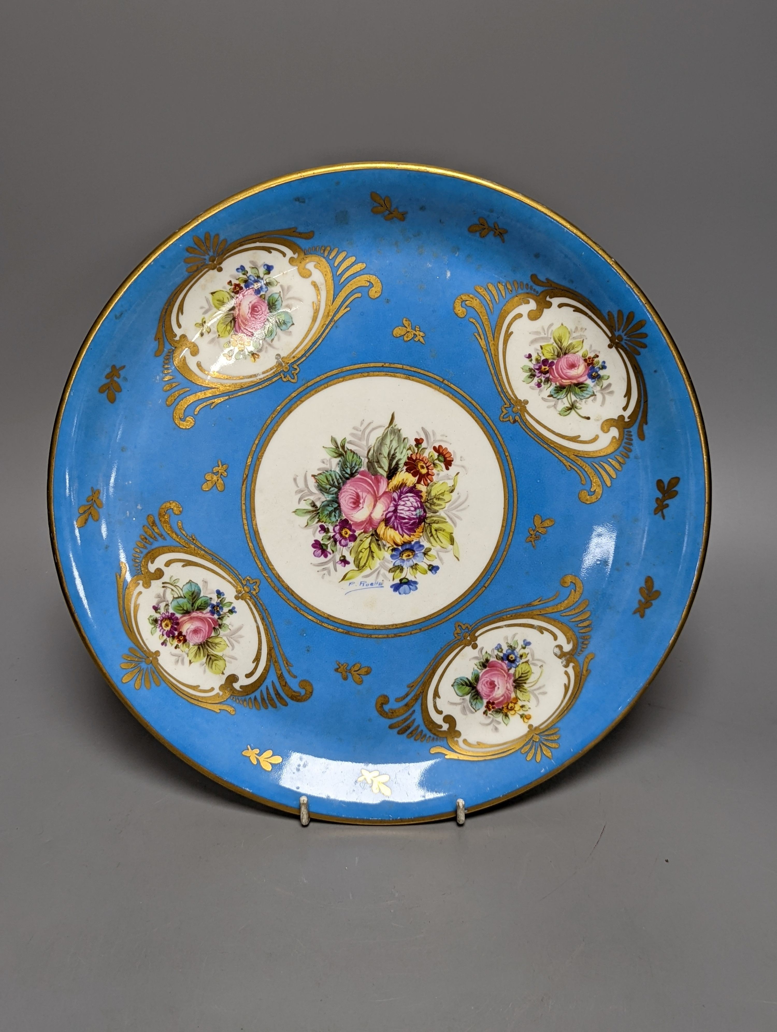 A Sevres style boat shaped dish and a Limoges circular dish, Sevres dish 27 cms wide & Limoges dish 31 cms diameter.